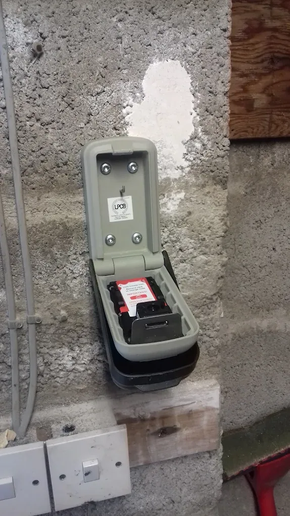 Police-approved wall-mounted key safe fitted beside a front door